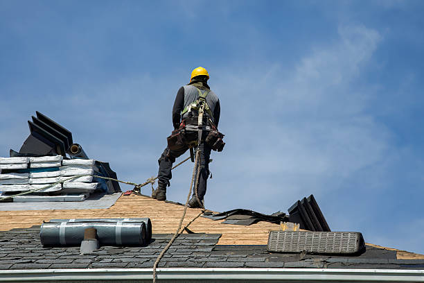 Professional Roof Replacement technician working in Carson City, MI